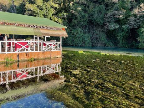 restaurant-above-the-pool-with-reflection-in-the-water-at-the-blue-eye-in-southern-albania