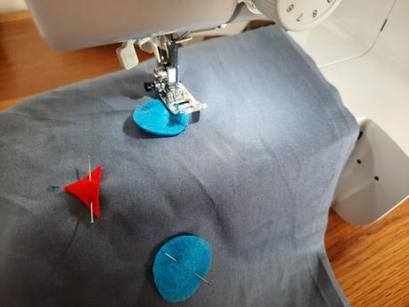 Sewing the eyes on my cat bag