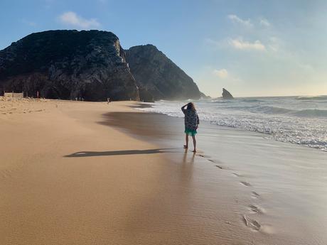 woman-walking-on-beach-in-portugal-one-word-captions-for-travel