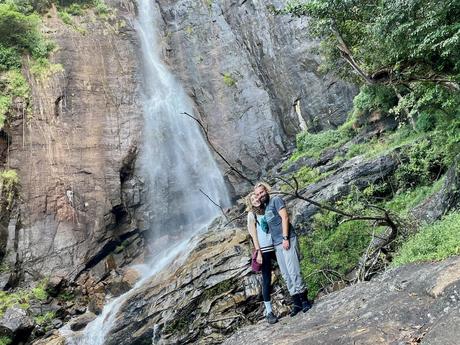 couple-travel-quotes-instagram-standing-underneath-waterfall