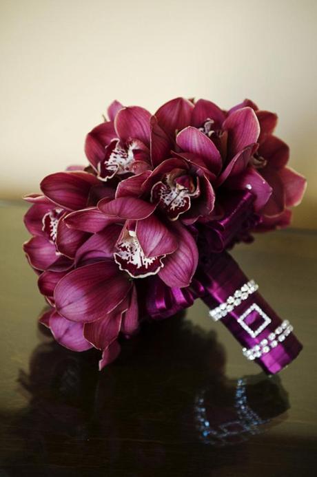 Purple wedding bouquet with bejewelled stem