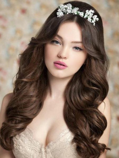 Romantic wedding hairstyle with delicate flower tiara