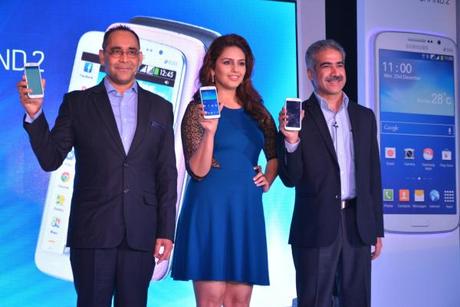 Mr. Vineet Taneja, Country Head - Mobile and IT, Samsung India and Mr. Manu Sharma, Director - Mobile, Samsung India launching GALAXY GRAND 2 with Bollywood actor Huma Qureshi in Mumbai.