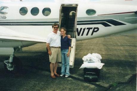 Courtesy of Christina McDowell Christina McDowell (then Prousalis) with her father and his private plane during headier times.