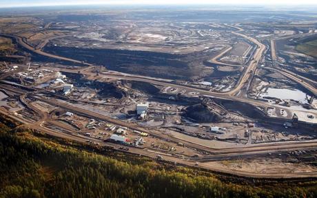 This aerial photo shows a tar sands mine facility near Fort McMurray, in Alberta, Canada. Jeff McIntosh/The Canadian Press/AP