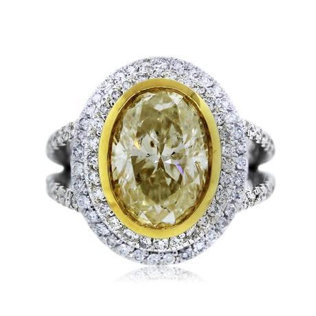 Propose with this 4 carat fancy yellow oval halo engagement ring in Vegas!