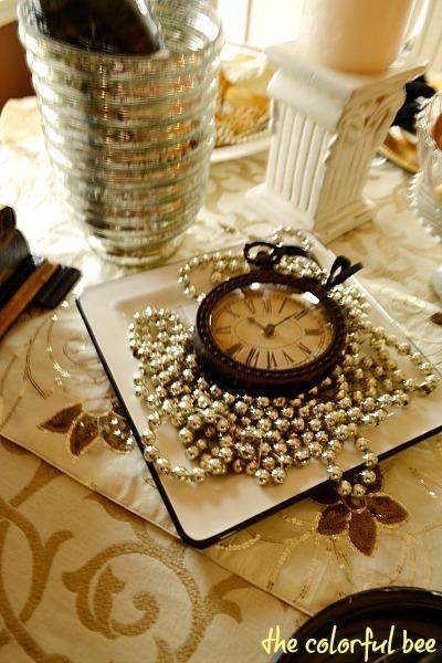 clocks on table set for New Year's celebration