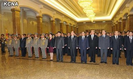 Kim Jong Un (8th L) and his wife Ri Sol Ju (7th L) visit Ku'msusan Palace of the Sun in Pyongyang on 1 January 2014.  Also seen in attendance are Gen. Kim Won Hong (L), VMar Kim Yong Chun (2nd L), Pak To Chun (3rd L), Gen. Jang Jong Nam (4th L), Gen. Ri Yong Gil (5th L), VMar Choe Ryong Hae (6th L), Kim Yong Nam (6th R), Pak Pong Ju (5th R), Kim Ki Nam (4th R) Choe T'ae Bok (3rd R), Yang Hyong Sop (2nd R) and Kang Sok Ju (R) (Photo: KCNA).