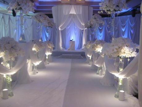 white decoration for the wedding aisle