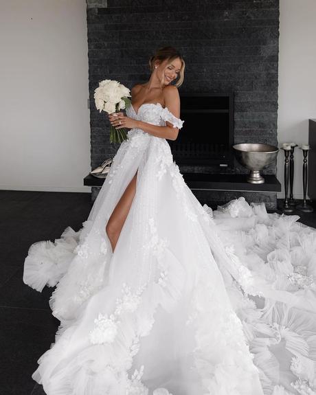 things brides regret not doing at their wedding bride smiling in a wedding dress