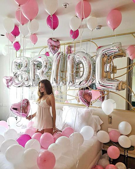 Bride with balloons on wedding day