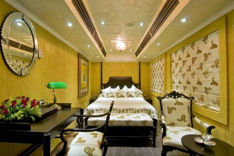 A luxurious coach with a bed and sofa in a luxurious train