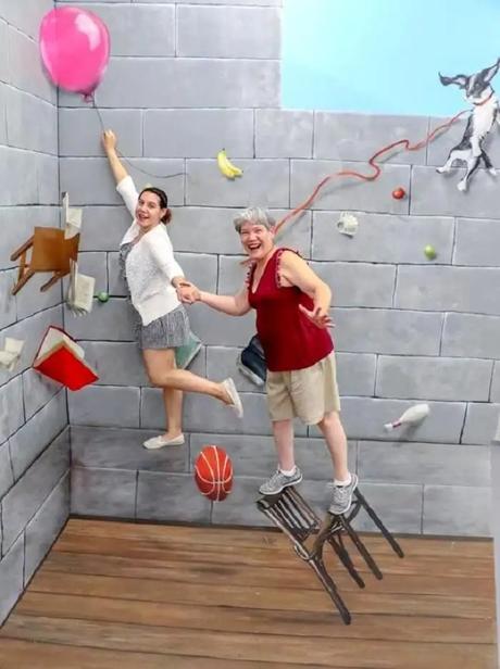 People having fun in the museum of illusions