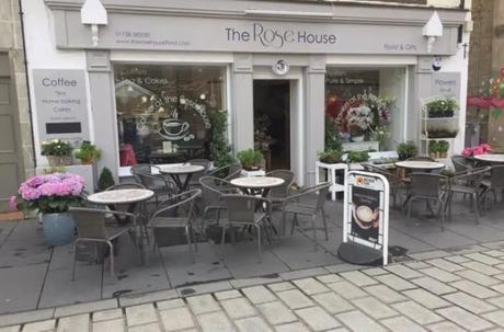 Coffee and cake among the roses