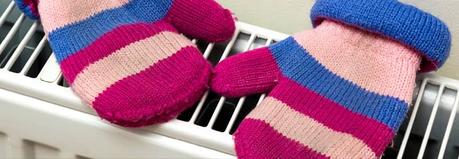 winter gloves being dried on a radiator