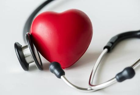 a plastic heart and a stethoscope