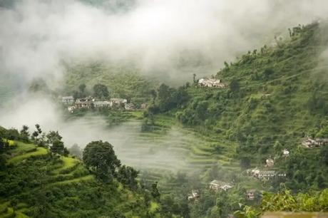19 Most Beautiful Places To Visit In Uttarakhand In Winter 2022 Mist covers the green hills on a winter morning in Khirsu