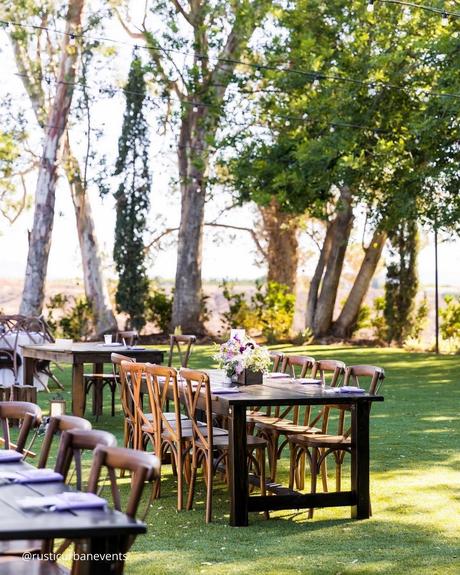 wedding receptions table set by the lake