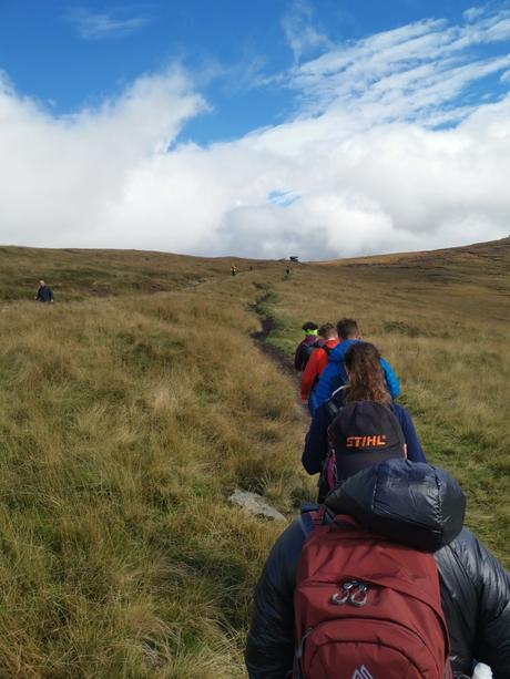 Celebrating the Great Outdoors: National Hiking Day in the UK Group of hikers walking up to Kinder Scout, the highest point in the Peak District, UK.