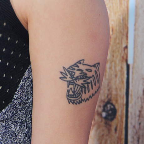 Awkwafina’s tiger face forearm tattoo