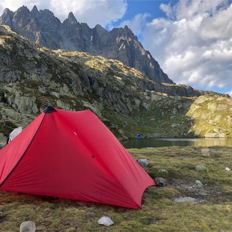Tour du Mont Blanc: Insights for Hikers Tent pitched by a lake on the TMB