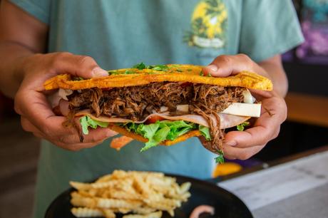 cuban sandwich filled with ropa vieja slow cooked pulled meat