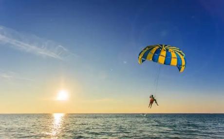 parasailing over an ocean
