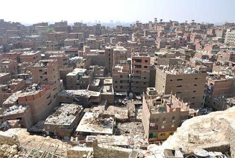 Rooftop sorting of garbage and recyclable materials in Manshiyet Nasir, Cairo. [Photo by Joseph Hill]