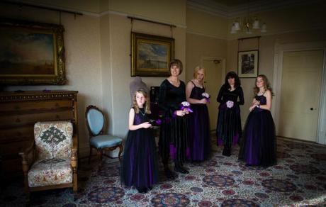 Bridesmaids wearing purple for gothic wedding