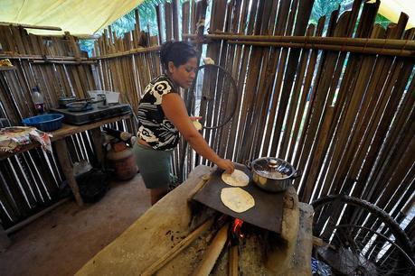 Campesin@ making tortillas in a land occupation / cooperative in Aguán Valley