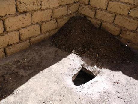 Hole in the floor  into a 2m dry chamber to which soil is added. At the end of every autumn the night soil has completely broken down and is used in the vegetable garden. 