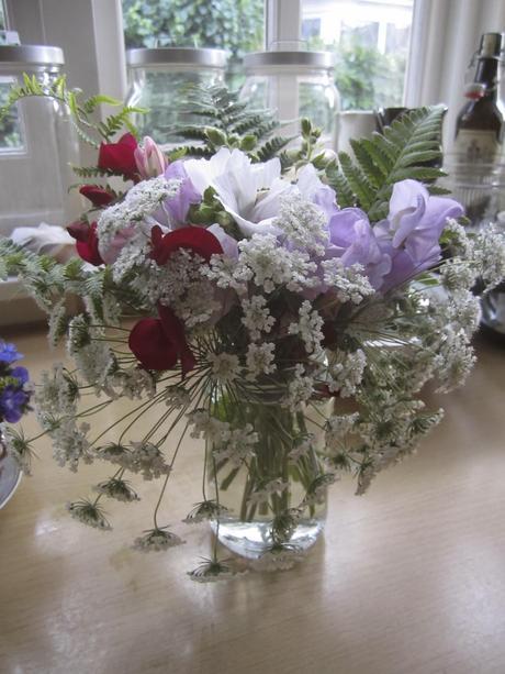 lovely jam jar bunches of British flowers Lovely, natural table centrepiece.