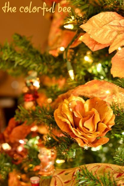 florals and faux poinsettias in Christmas tree