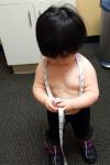 January 7 - Taking our 18mth measurements while waiting for the doctor.