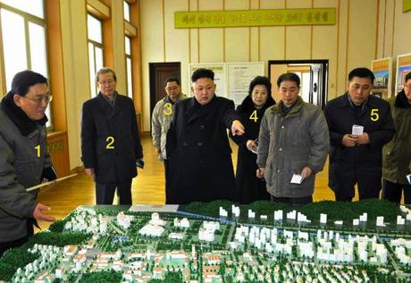 Kim Jong Un views a scale model at the State Academy of Sciences.  Also in attendance are: President of the State Academy of Sciences Jang Chol (1), KWP Secretary Choe T'ae Bok (2), KWP Organization Guidance Department Deputy Director Pak Thae Song (3), KWP Science Education Department Director Han Kwang Bok (4) and KWP Finance and Accounting Deputy Director Ma Won Chun (5) (Photo: Rodong Sinmun).