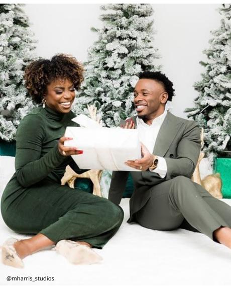 winter engagement photos winter couple is exchaging with gifts