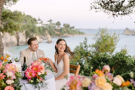 All fresco summer wedding in Kefalonia with colorful flowers | Skye & Chris