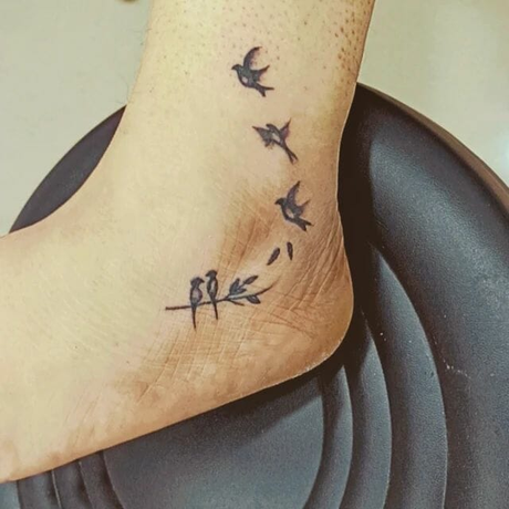 21 Hottest Ankle Tattoo Ideas: Simple Designs with Significance to Kickstart 2024! 27 Birds taking flight in black ink on ankle