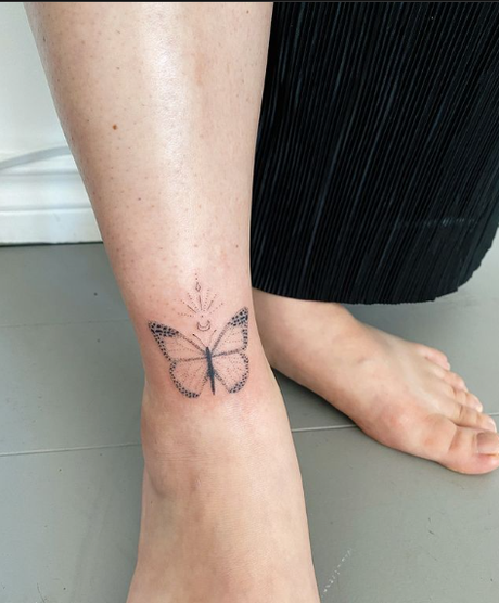 21 Hottest Ankle Tattoo Ideas: Simple Designs with Significance to Kickstart 2024! 12 Butterfly tattoo on ankle in black ink