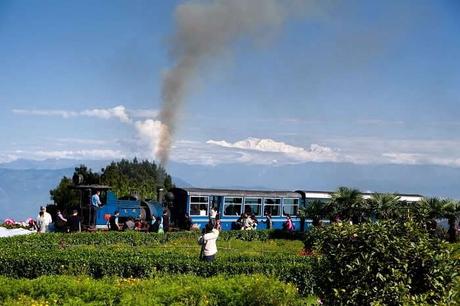 Toy train in Darjeeling on the background of mount Kanchenjunga