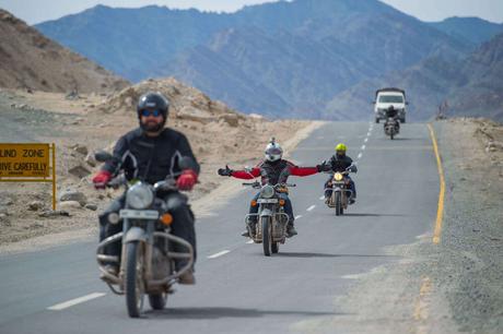 Men riding bikes on the roads of Ladakh