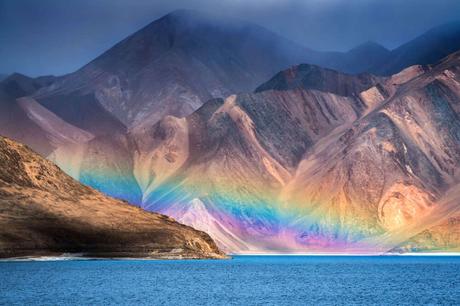 Rainbow in the mountains over a lake