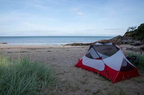 Tent camping on a remote beach at the end of Almorness Point