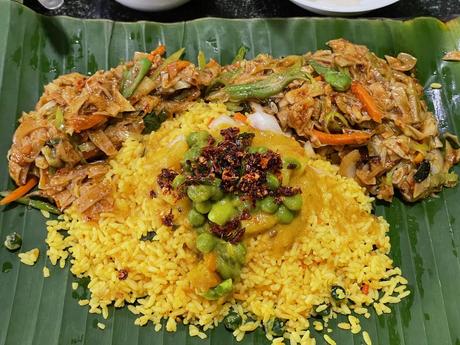 spicy rice and noodles with dahl and curry served on a banana leaf at a restaurant in colombo sri lanka