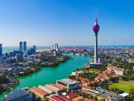 Aerial view of central Colombo showing the Colombo Lotus Tower and Beira Lake with the fort area and port beyond