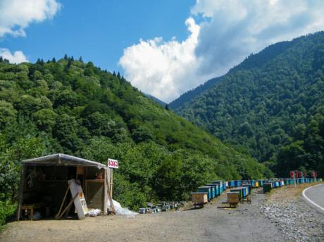 Beehives and honey sold by the roadside on the road from Tbilisi to Mestia