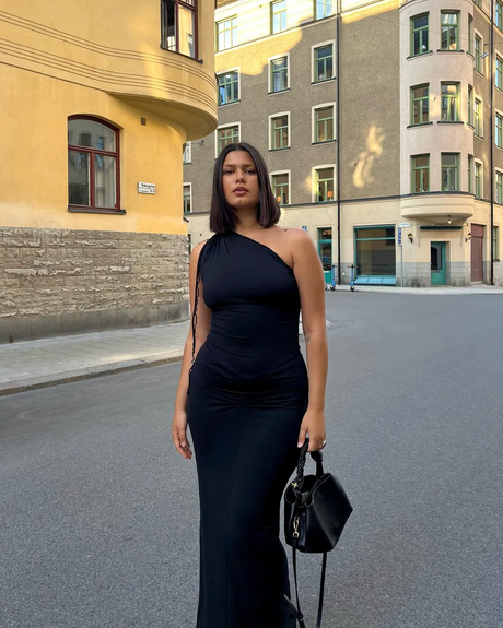 Spring Outfit Trends: Discover the Hottest Looks in 2024! 17 One-Shoulder Black Dress + Top-Handle Bag