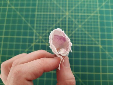 Sewing a scrunchie: turn the tube of fabric halfway right so the short sides match. Match the seams and pin your short sides and pin in place.