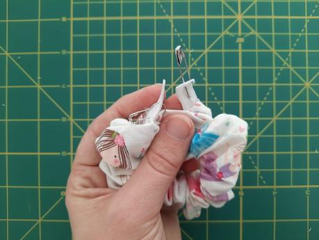 Sewing a scrunchie: use a safety pin to thread elastic throug the ring of fabric