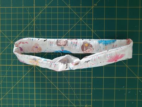 Sewing a scrunchie: turn the fabric tube upright using the opening at the bottom